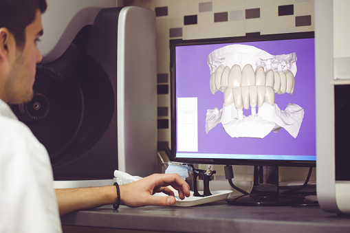 A dental hygienist at Wanserski Dental Center for Complex Dentistry working on the 3D imaging system in Wausau, WI A dental hygienist at Wanserski Dental Center for Complex Dentistry working on the 3D imaging system in Wausau, WI